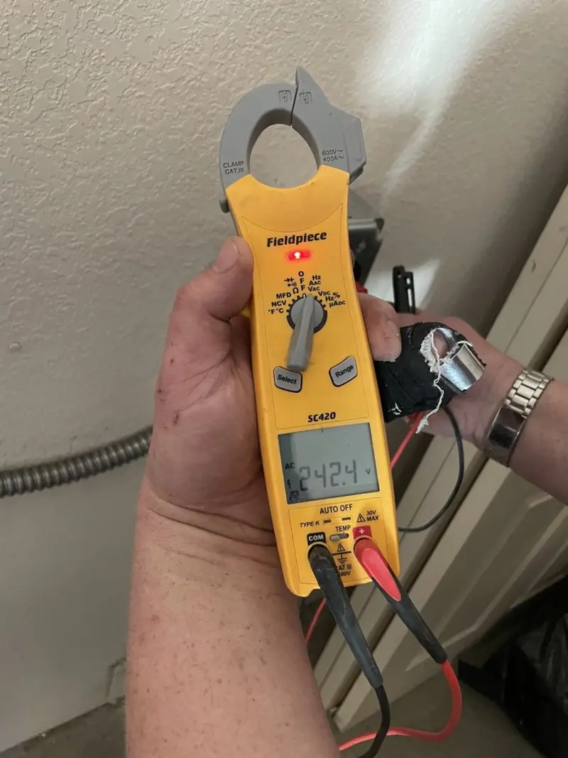Voltage testing with clamp meter during Hot Tub / Pool Electrical Wiring in Newton